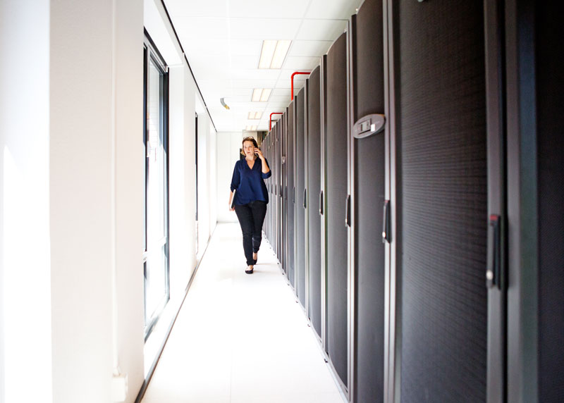 Woman walking in dataroom Woman walking in dataroom