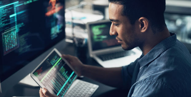 Man with tablet at a workstation